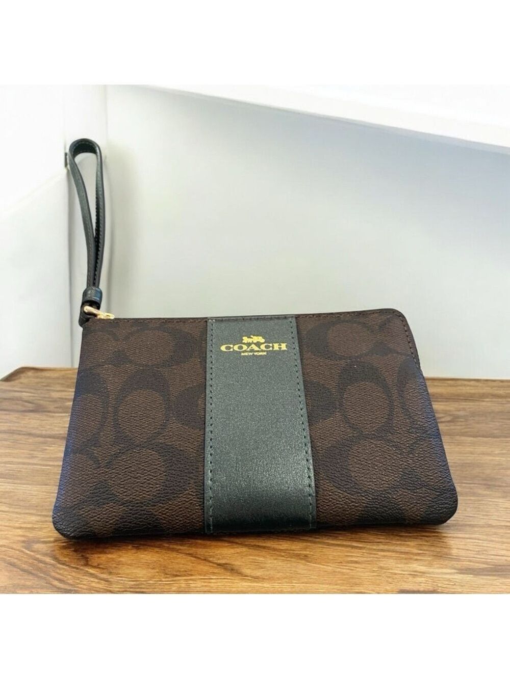 Coach signature C coated canvas wristlet w dark brown stripe Gold embossed logo